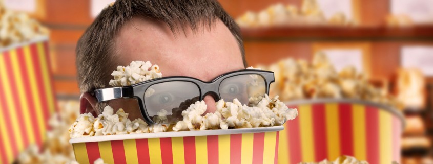 Man's in a bucket of popcorn